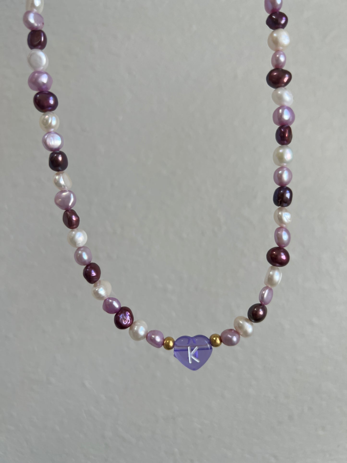 Initial purple pearl